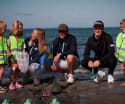 Players join local pre-school children and staff in beach clean ahead of Volvo Car Scandinavian Mixed