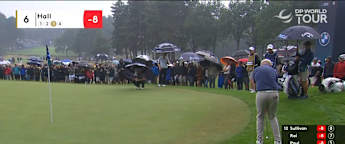 Harry Hall chips in from the rough behind the sixth green