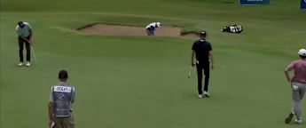 Geoff Ogilvy holes a birdie putt at the 9th