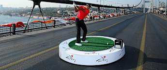 Woods swings into history books