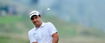 Khan moves into contention