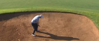 Ross McGowan holes out from the bunker in Sun City 