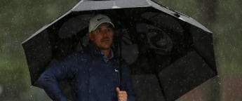 Brooks Koepka builds commanding lead before unrelenting rain forces overnight suspension