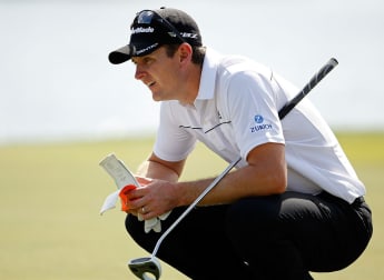 Rose leads but McIlroy looms