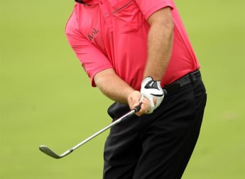 McDowell remains hot on Woods' heels