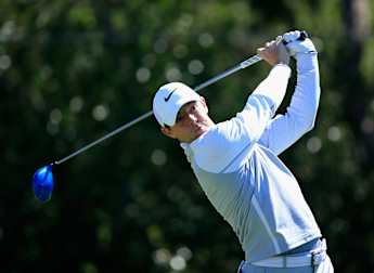 McIlroy advances after play-off