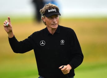 Langer leads on testing opening day
