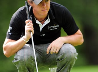 McIlroy retains control in Shanghai