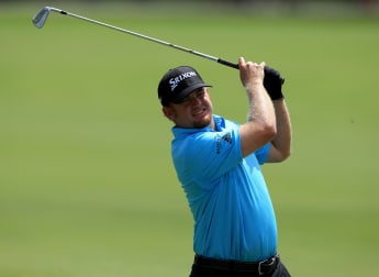 Holmes builds sizeable first round lead
