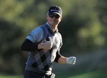 Johnson moves ahead of Woods