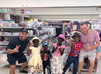 Max Kieffer and caddie Takashi Ohagen help out Kenyan community