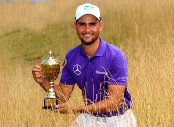 Rampant Lampert runs up hat-trick of titles 