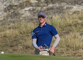 Howie posts course record to lead in Abu Dhabi