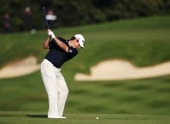 Westwood remains on course