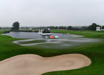 Rain delays round three in Germany