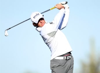 McIlroy battles back to lead Westwood