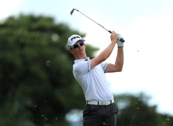 Stone holds halfway lead in South Africa