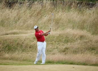 Westwood hangs tough