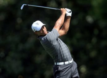Woods surges to victory