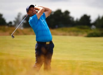 Harrington among leaders in Scotland