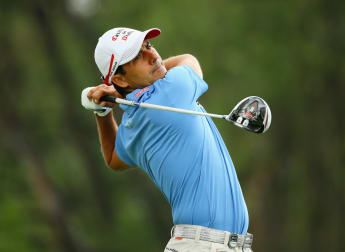 Aguilar leads as play suspended in Beijing