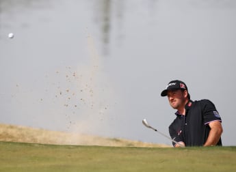 McDowell and Molinari stand firm in strong wind