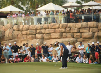 Dubuisson takes narrow lead into final round