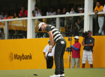 Late surge hands Holman lead