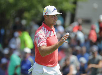 Record-breaking Woodland maintains Bellerive lead