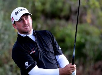 McDowell moves ahead before play suspended