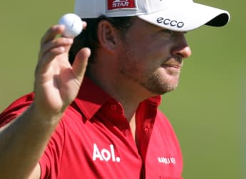 McDowell overcomes McIlroy to reach last eight