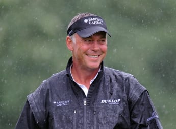 Clarke makes light work of heavy rain