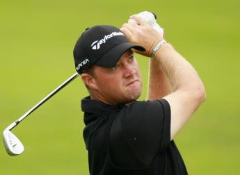 Hanson charges to outright lead