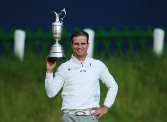 Johnson holds his nerve to land Claret Jug