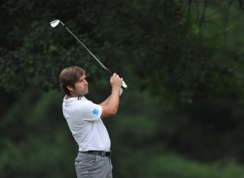 Rock holds steady to lead in Turin