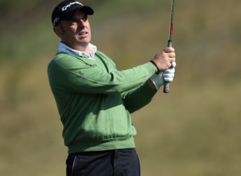 McGinley moves into contention
