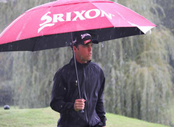 Borja battles Roman rain to share lead