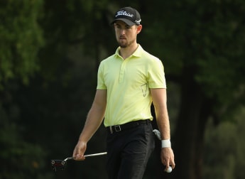 Ambitious Holman takes Malaysia lead