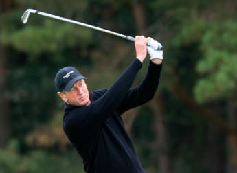 Drummond moves top at The International