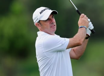 McGinley takes early lead