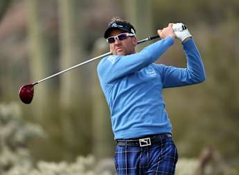 Poulter progresses to second round