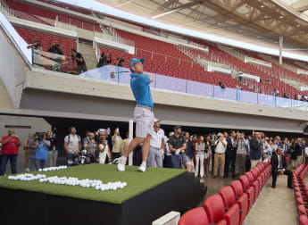 Garcia plays ball at rivals' football stadium