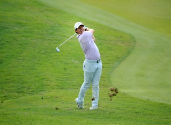 McIlroy moves into Shanghai share
