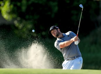 Big finish flies Rahm into contention