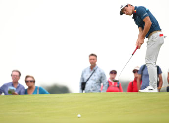 Hovland impresses on Open debut