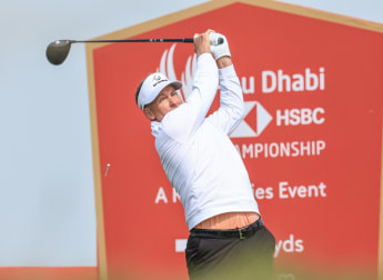 Poulter delves into his golfing archive in windy Abu Dhabi