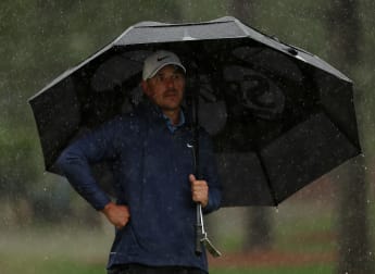 Brooks Koepka builds commanding lead before unrelenting rain forces overnight suspension