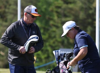 Ex-Premier League referee Mike Dean caddying at Volvo Car Scandinavian Mixed 