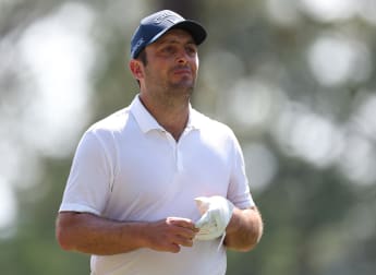 Francesco Molinari makes cut with stunning ace