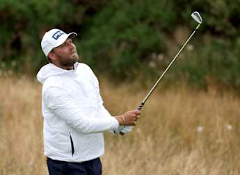 Dan Brown leads The Open after dream debut at Troon